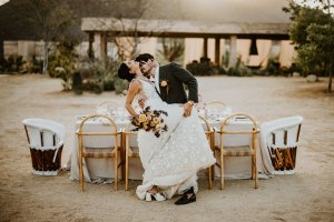 Cabo Minimalist Elopement with organic floral arch and ocean backdrop.